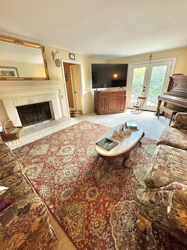 living room with a brick fireplace, french doors, and carpet