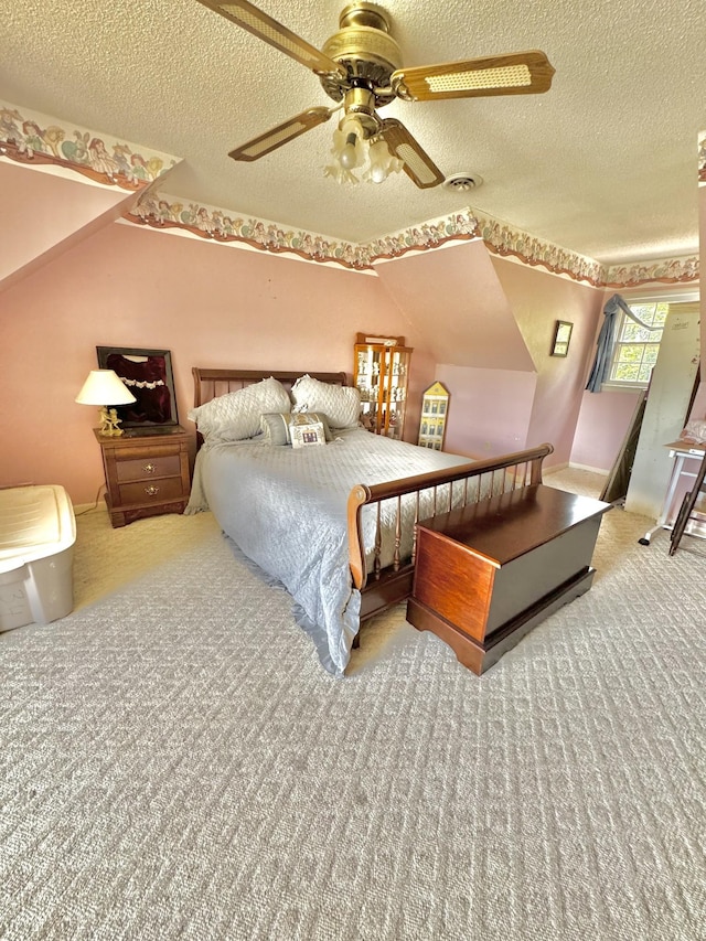 carpeted bedroom with visible vents, a textured ceiling, and ceiling fan