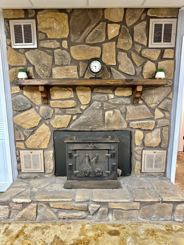 room details with visible vents and a wood stove