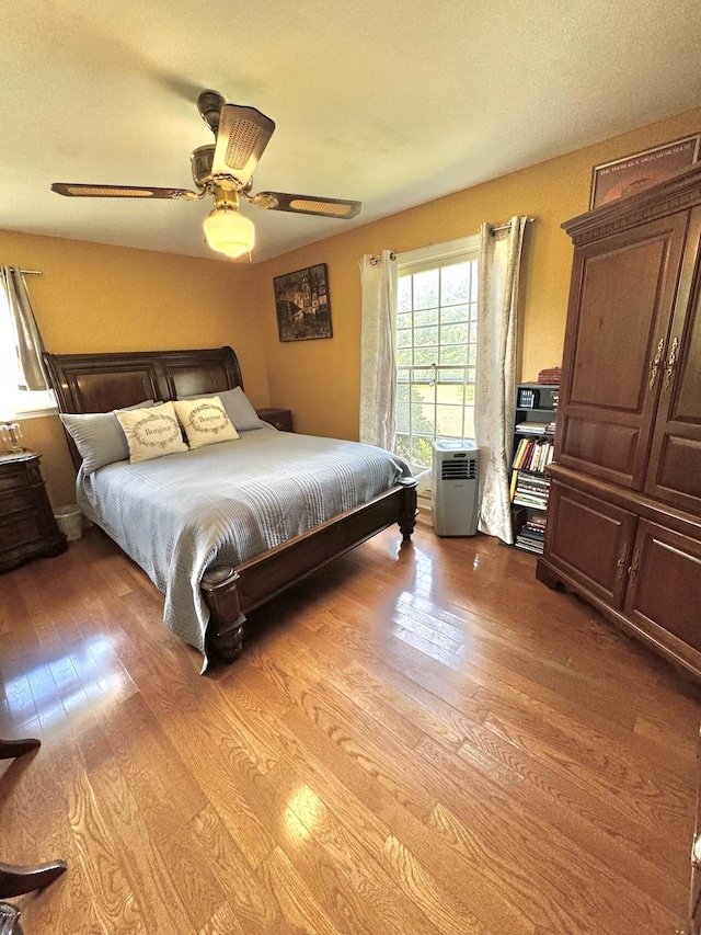 bedroom with light wood-style flooring and ceiling fan