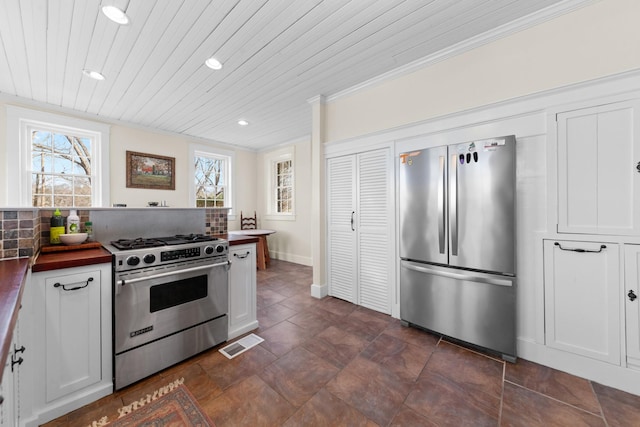 kitchen featuring visible vents, recessed lighting, stainless steel appliances, wood ceiling, and white cabinetry