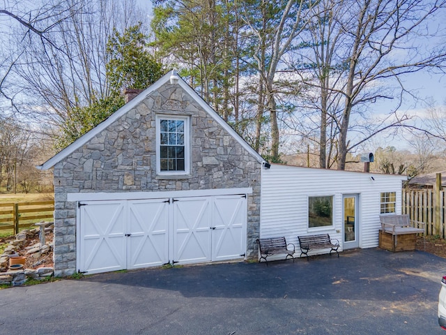 exterior space with an outbuilding and fence