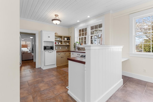 kitchen with baseboards, open shelves, white cabinets, crown molding, and wooden ceiling