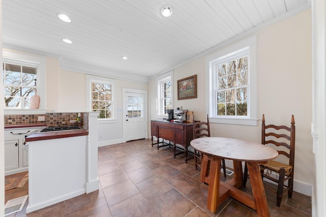 dining space featuring wooden ceiling, recessed lighting, baseboards, and ornamental molding