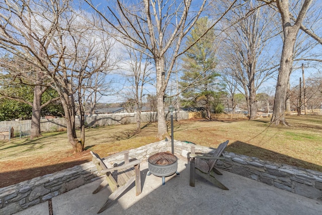 view of yard with an outdoor fire pit, a patio, and fence