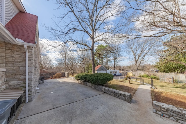 view of patio featuring fence