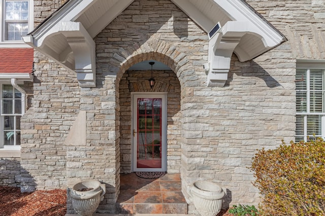 entrance to property with stone siding