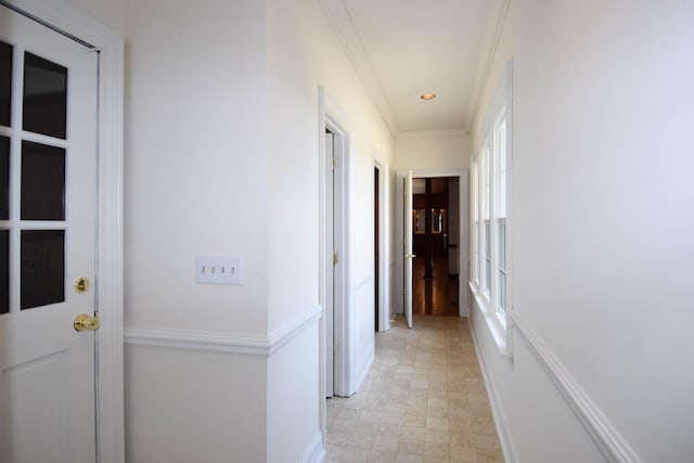 hall with crown molding, recessed lighting, and baseboards