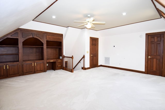 interior space with recessed lighting, visible vents, light colored carpet, and vaulted ceiling