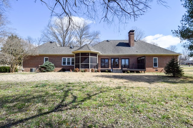 back of property featuring brick siding, central AC, a chimney, a sunroom, and crawl space