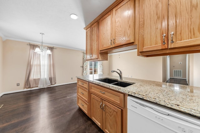 kitchen with a sink, ornamental molding, visible vents, and white dishwasher