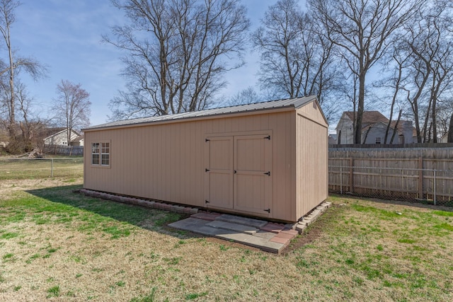 view of shed featuring a fenced backyard