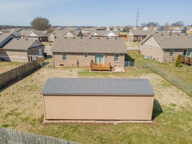 exterior space featuring a fenced backyard, a residential view, and a deck