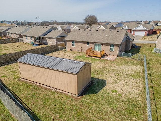 exterior space featuring a fenced backyard, a residential view, and a deck