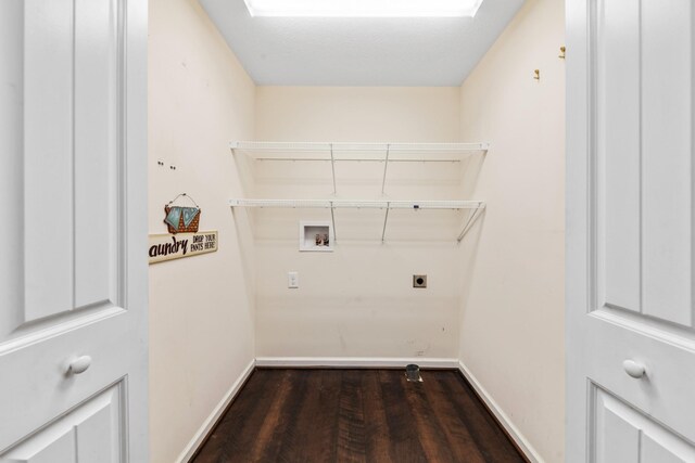 laundry area with electric dryer hookup, washer hookup, a skylight, baseboards, and laundry area