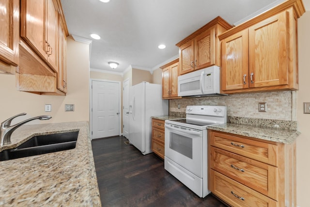 kitchen with white appliances, dark wood-style floors, a sink, crown molding, and tasteful backsplash