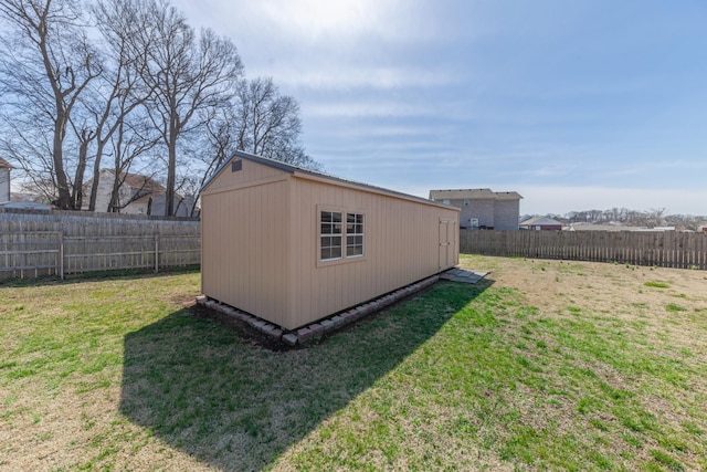 view of shed featuring a fenced backyard