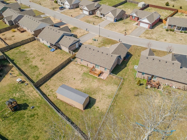 birds eye view of property with a residential view