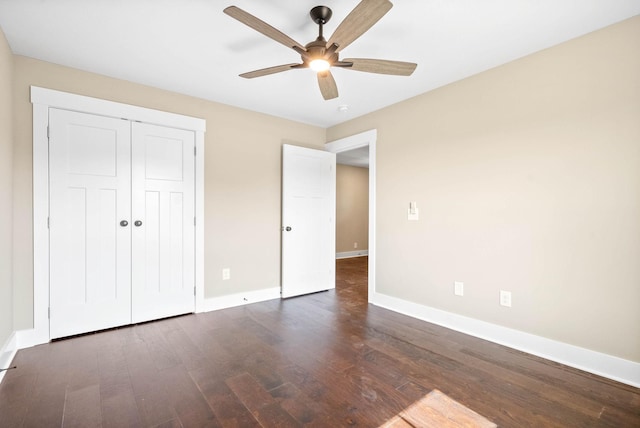 unfurnished bedroom with a closet, a ceiling fan, baseboards, and wood finished floors