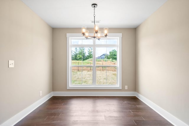 unfurnished dining area with visible vents, dark wood-type flooring, and baseboards