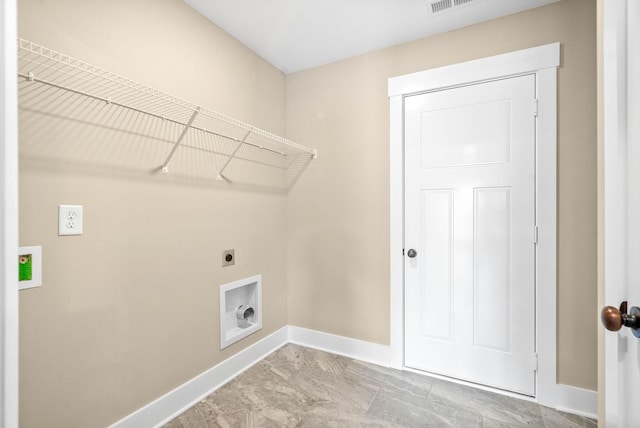 clothes washing area with visible vents, baseboards, hookup for an electric dryer, and laundry area