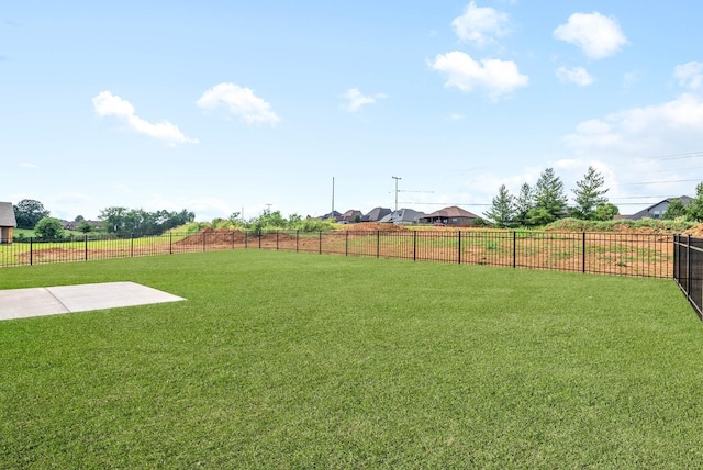 view of yard featuring a patio and fence