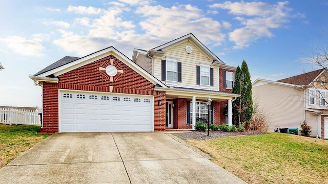 traditional-style house featuring a garage, brick siding, concrete driveway, and fence