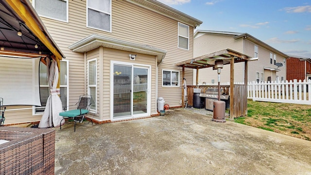 view of patio featuring fence