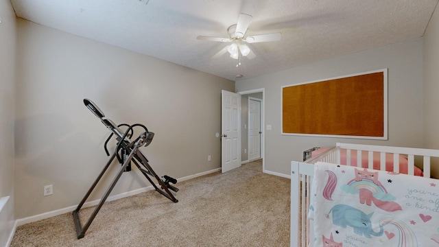 bedroom with carpet flooring, ceiling fan, a textured ceiling, and baseboards