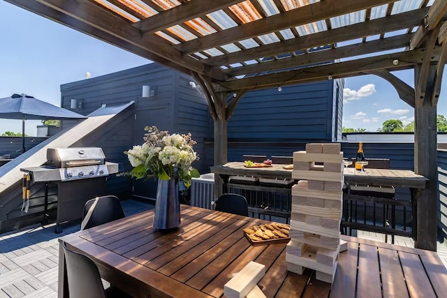 deck featuring outdoor dining space, a pergola, and central AC