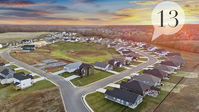 aerial view at dusk with a residential view