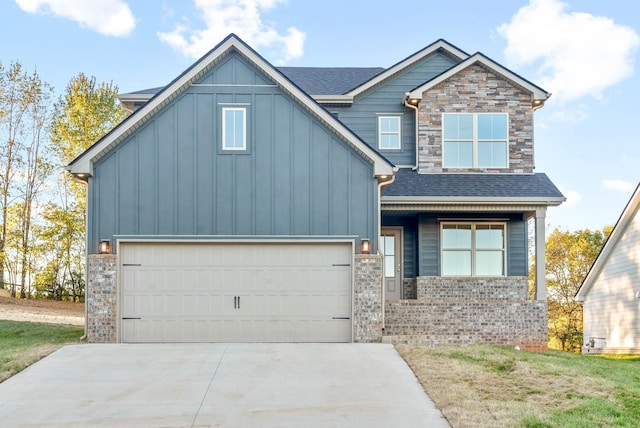 craftsman-style house with driveway, stone siding, board and batten siding, a shingled roof, and a garage