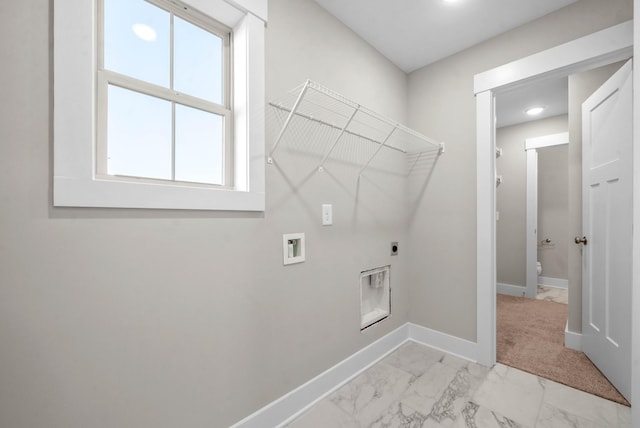 washroom featuring baseboards, washer hookup, laundry area, marble finish floor, and hookup for an electric dryer