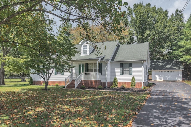 2536 Crescent Meadows Ct, Murfreesboro, TN 37128 - cape cod home featuring an outbuilding, covered porch, a shingled roof, a front lawn, and a detached garage