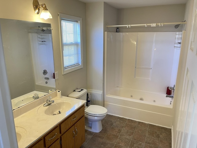 bathroom with bathtub / shower combination, double vanity, toilet, and a sink