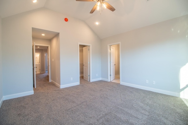 unfurnished bedroom featuring baseboards, high vaulted ceiling, recessed lighting, light carpet, and a walk in closet