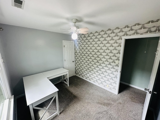 interior space featuring visible vents, carpet floors, baseboards, and ceiling fan