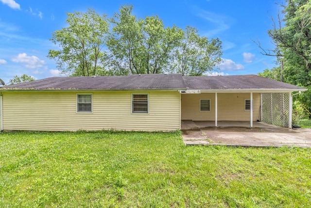 back of house featuring a yard and a patio area