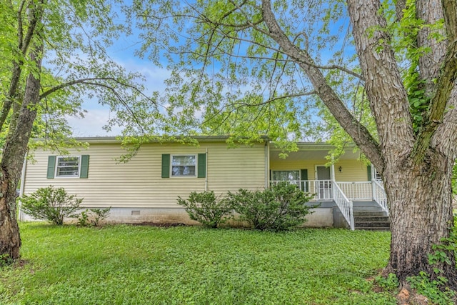 view of front of house with crawl space, covered porch, and a front yard