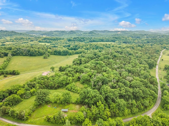 drone / aerial view featuring a forest view