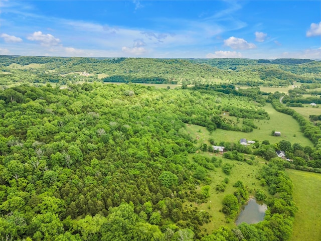 aerial view featuring a wooded view