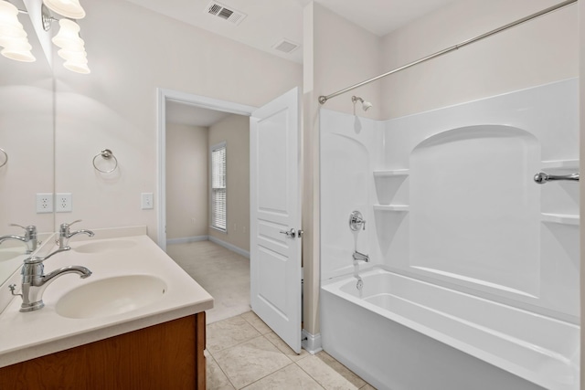 bathroom featuring bathtub / shower combination, visible vents, and a sink