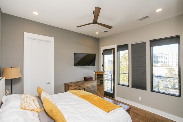 bedroom with recessed lighting, visible vents, baseboards, and dark wood finished floors