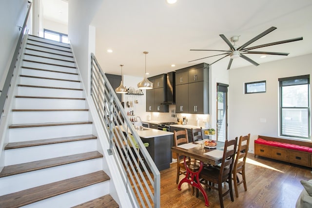 dining area with dark wood finished floors, stairs, recessed lighting, and ceiling fan