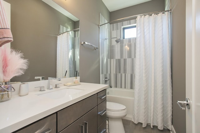 full bath with vanity, toilet, and shower / bath combo with shower curtain