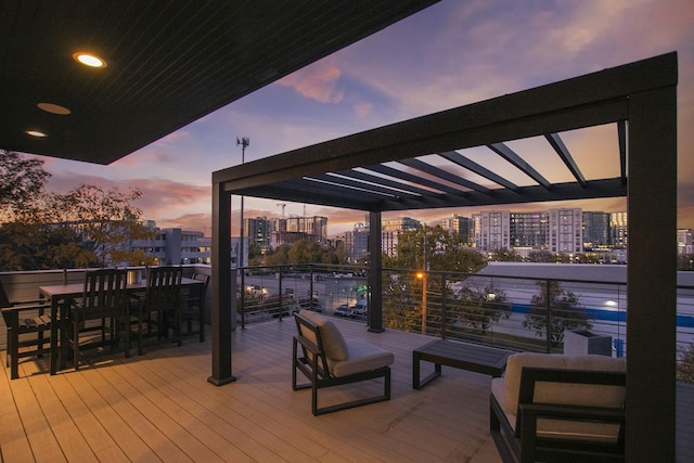 deck at dusk with a view of city