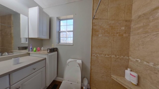 bathroom with tiled shower