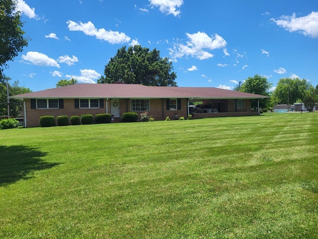 ranch-style house with brick siding and a front lawn