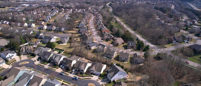 birds eye view of property with a residential view