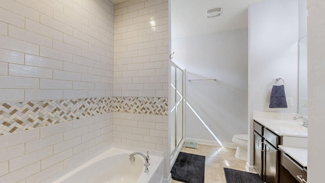 full bath with vanity, a shower with shower door, a garden tub, toilet, and tile patterned floors